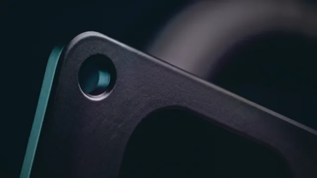 The same flange corner after vapor smoothing, with a closed satin black skin.