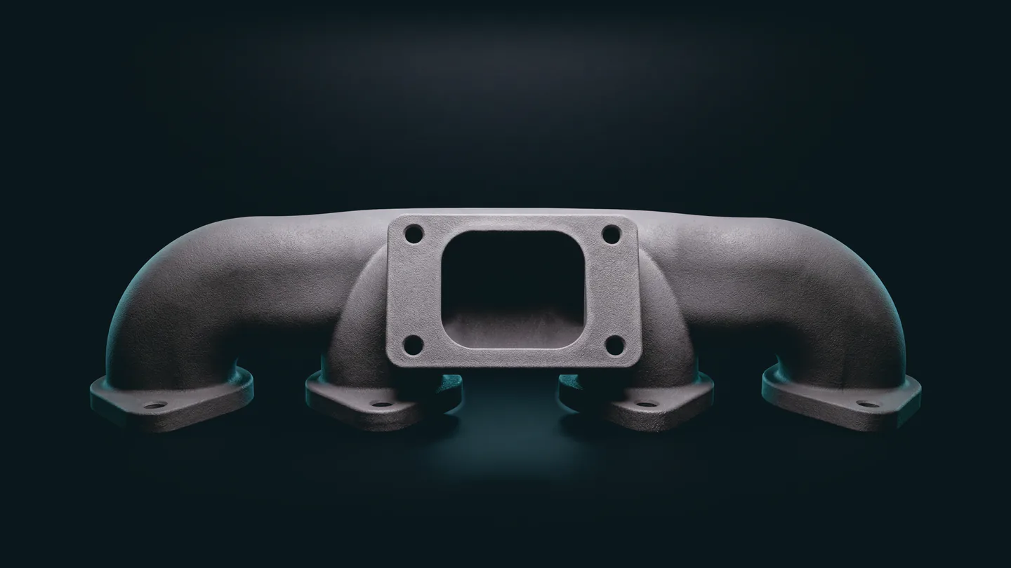 Render of the 3D-printed demo manifold as printed: matte gray with a fine powder grain, on a dark stage.