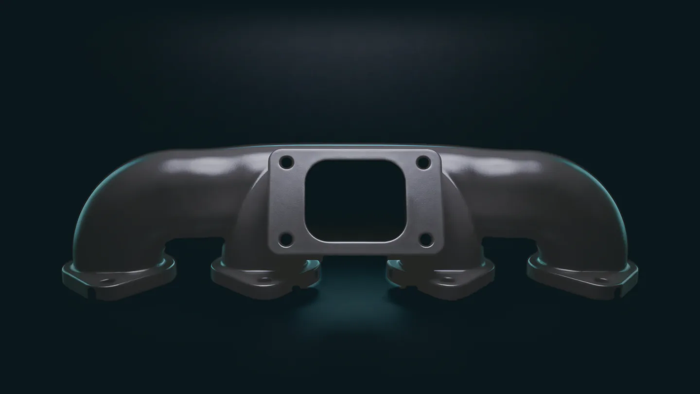 The same manifold after vapor smoothing: a sealed, satin black surface.