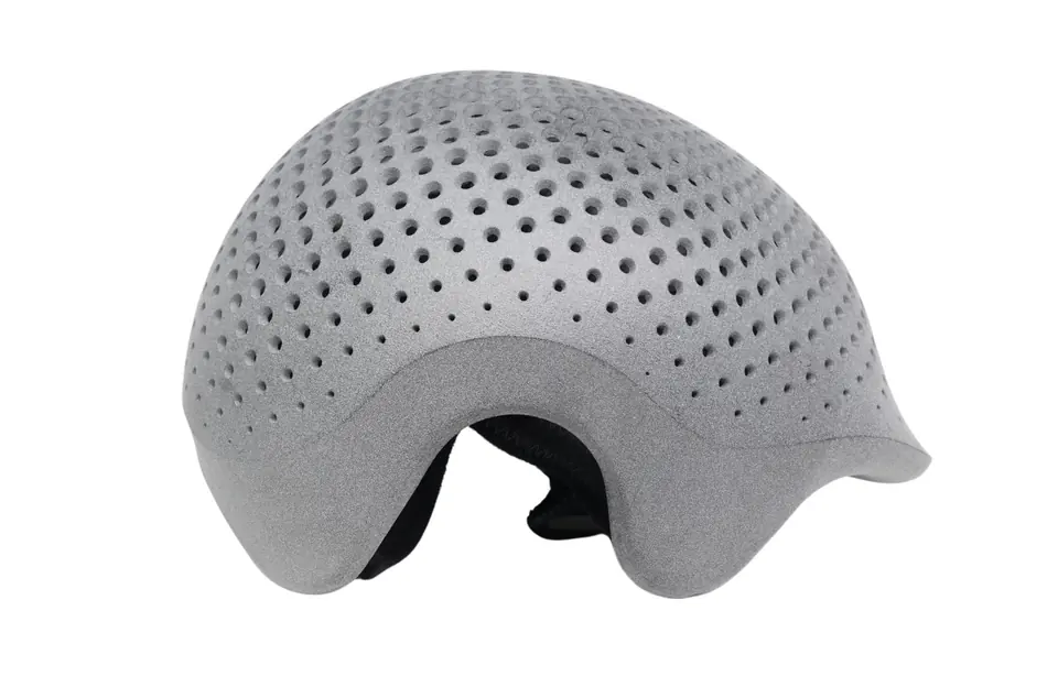 3D-printed lattice helmet shell as printed, with a matte gray, grainy surface