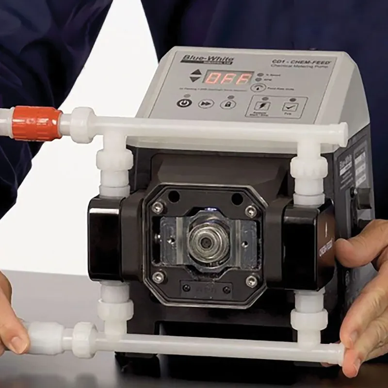 A Blue-White CHEM-FEED chemical metering pump held in two hands