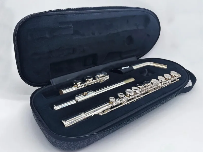 A flute and a 3D-printed mouthpiece in an open instrument case
