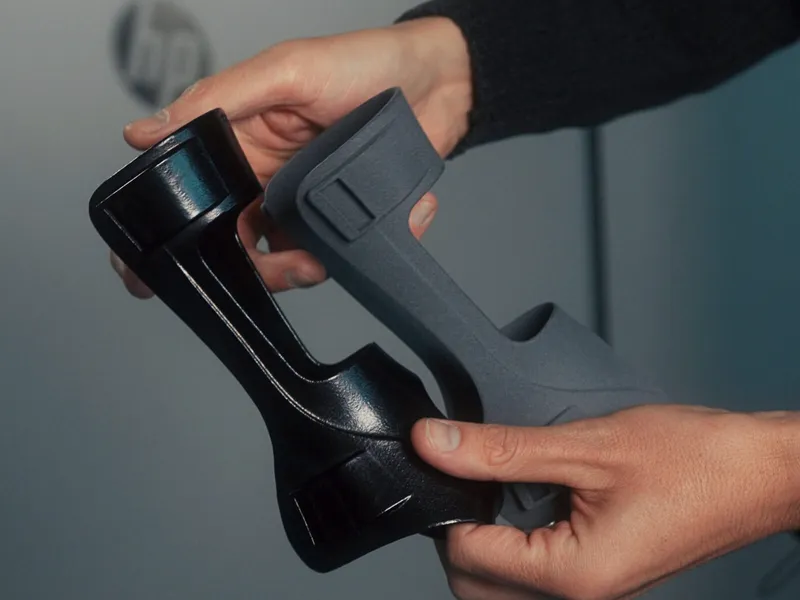 Two 3D-printed orthoses held side by side: one as printed, one after vapor smoothing