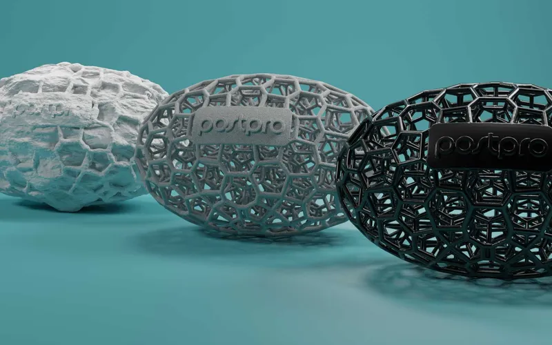 Three 3D-printed lattice eggs in white, gray and black
